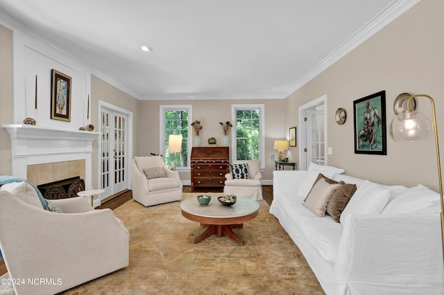 living room with a fireplace, crown molding, and french doors