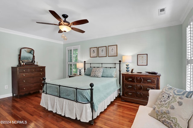 bedroom featuring ornamental molding, hardwood / wood-style floors, and ceiling fan