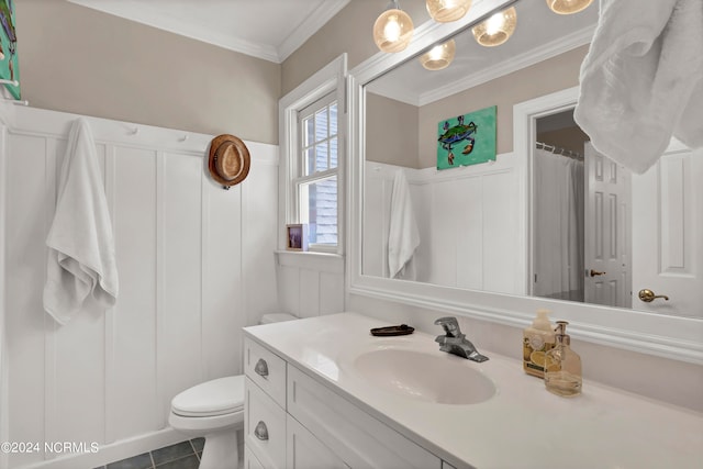 bathroom with ornamental molding, vanity, toilet, and tile patterned flooring