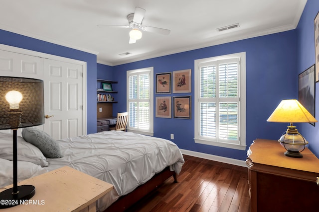 bedroom featuring ornamental molding, a closet, ceiling fan, and dark hardwood / wood-style floors