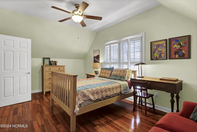 bedroom with dark wood-type flooring, vaulted ceiling, and ceiling fan