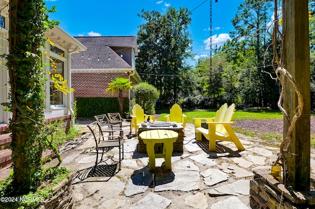 view of patio / terrace with a fire pit