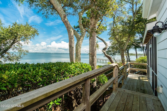 wooden terrace with a water view