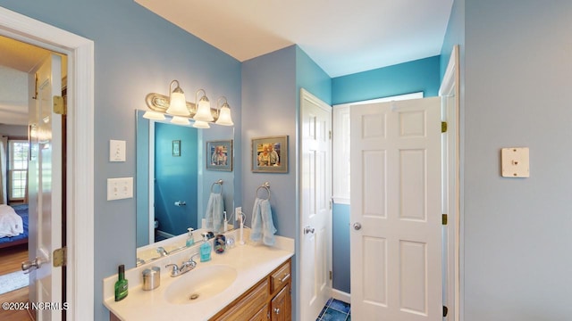 bathroom featuring hardwood / wood-style flooring, vanity, and toilet