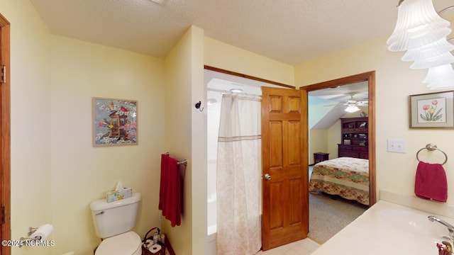 bathroom with a textured ceiling, ceiling fan, curtained shower, and toilet