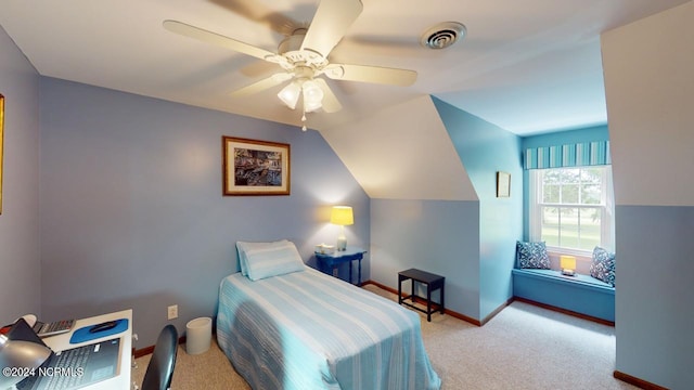 bedroom with light carpet, vaulted ceiling, and ceiling fan