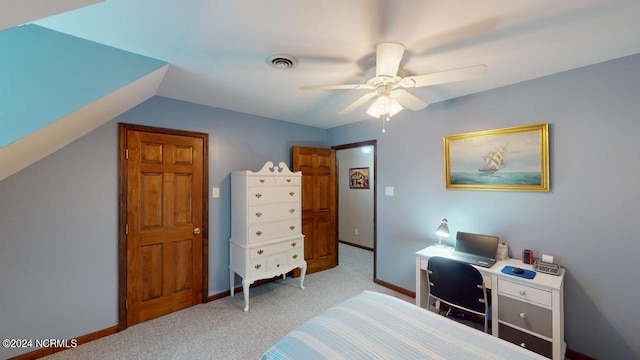 carpeted bedroom with ceiling fan and lofted ceiling