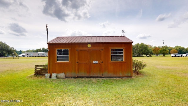 view of outdoor structure with a yard