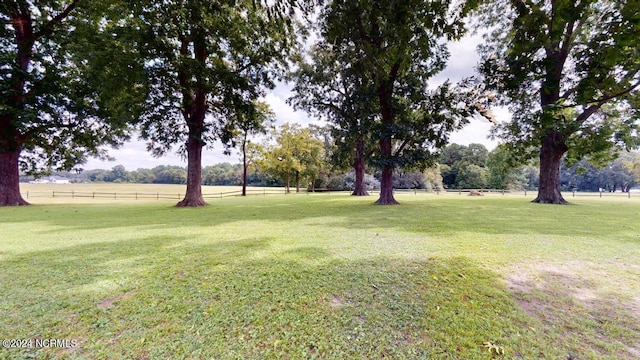 view of yard with a rural view