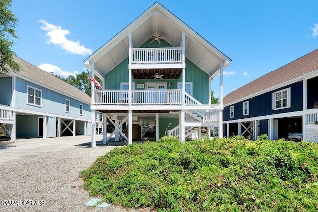 back of house with ceiling fan