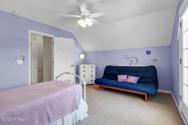 bedroom with carpet flooring, lofted ceiling, and ceiling fan