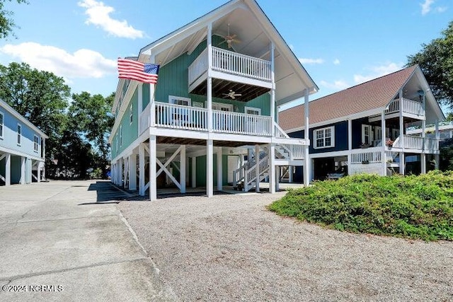 back of property with a balcony