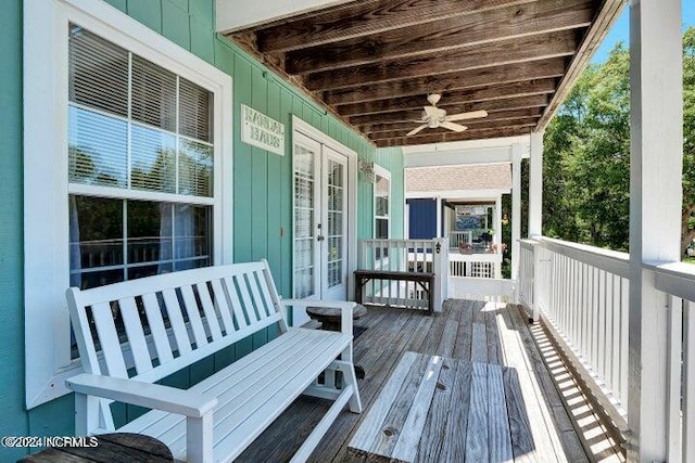 wooden terrace featuring ceiling fan