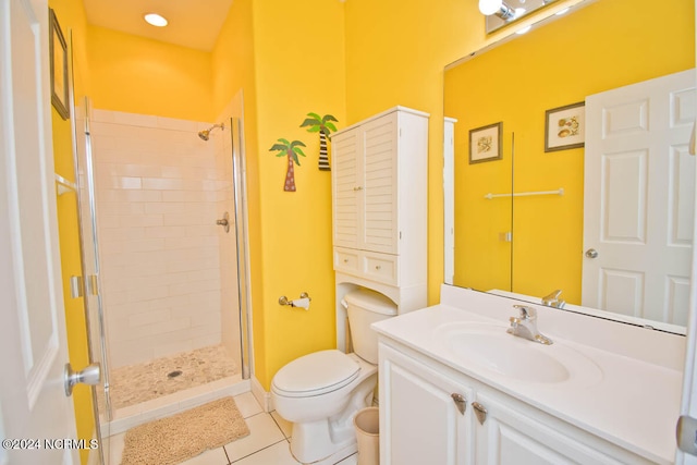 bathroom with tile patterned flooring, an enclosed shower, vanity, and toilet