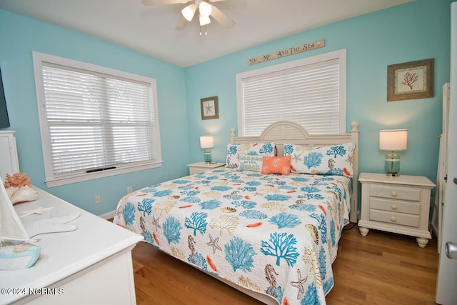 bedroom featuring wood-type flooring and ceiling fan