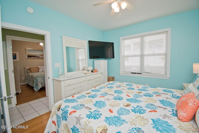 bedroom featuring ceiling fan and light hardwood / wood-style flooring