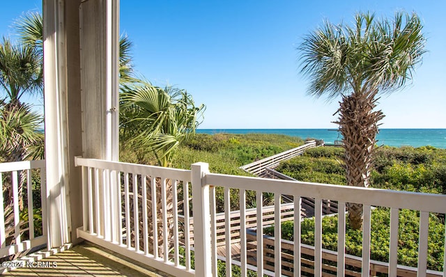 balcony featuring a water view