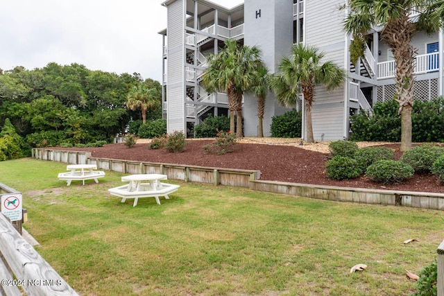 view of yard featuring a balcony