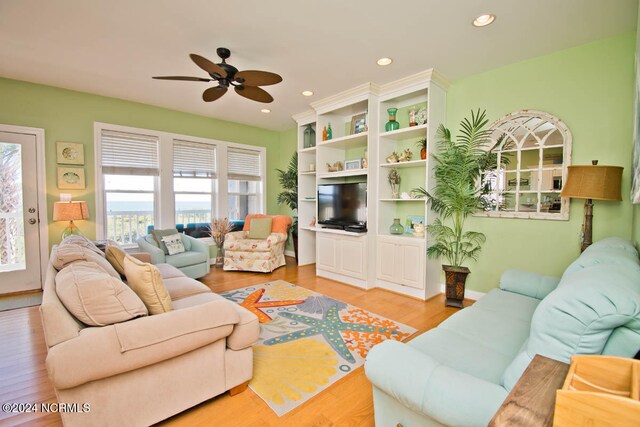 bedroom with ceiling fan and wood-type flooring