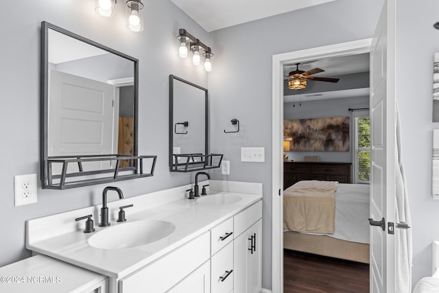 bathroom featuring wood-type flooring, vanity, and ceiling fan