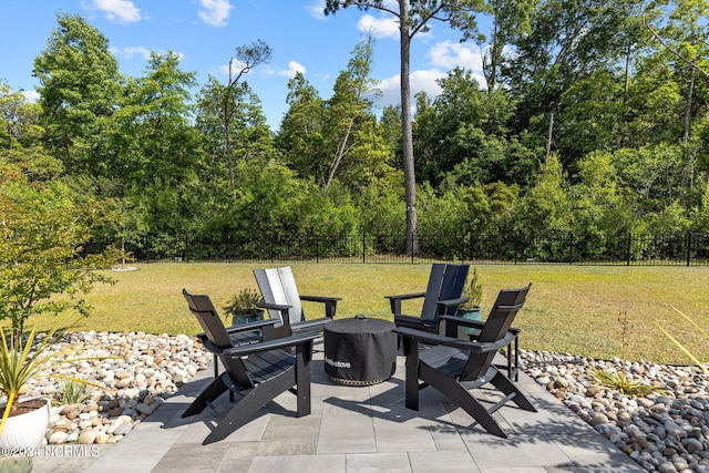 view of patio with an outdoor fire pit