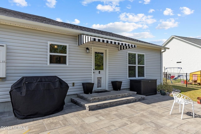 rear view of house featuring a patio area