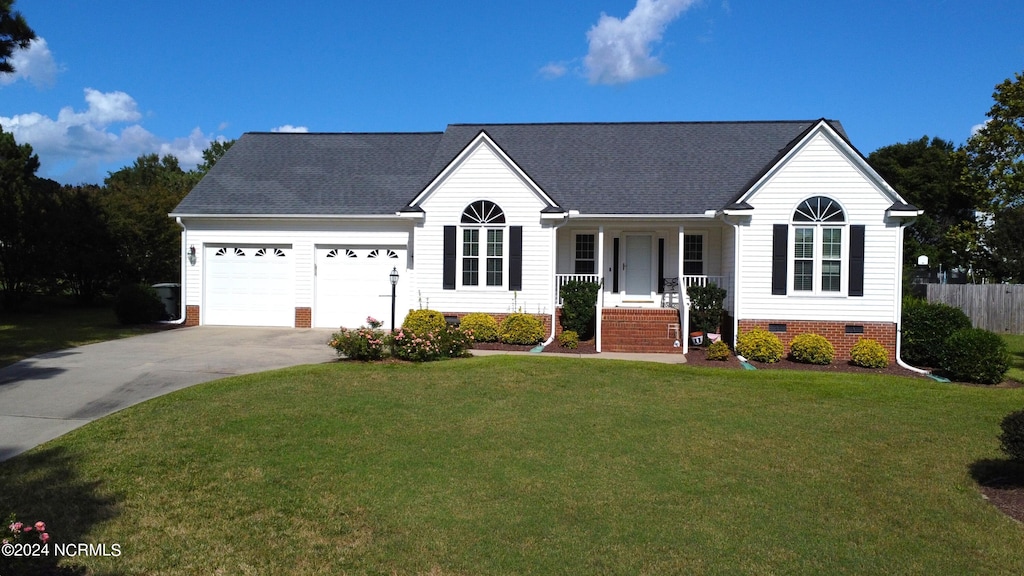 ranch-style home featuring a front yard and a garage