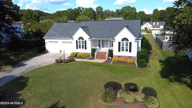 view of front of home featuring a garage and a front lawn