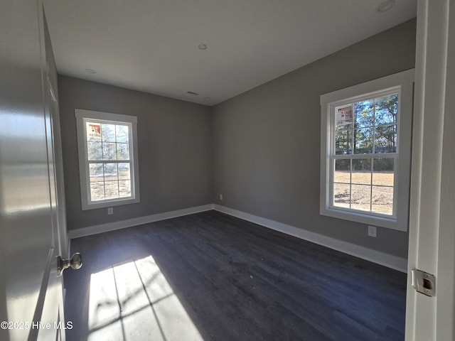 unfurnished room featuring dark hardwood / wood-style floors