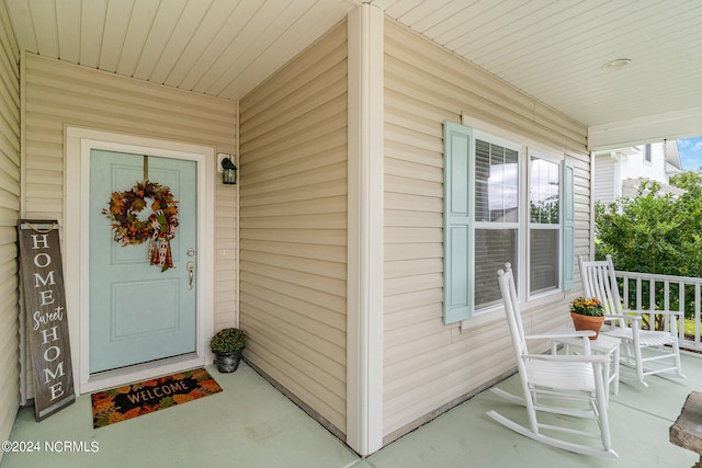 entrance to property with a porch