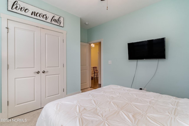 carpeted bedroom with a closet