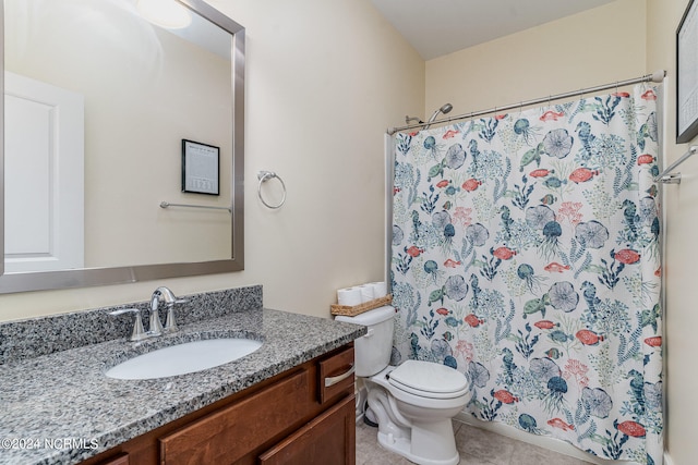 bathroom with tile patterned flooring, curtained shower, vanity, and toilet