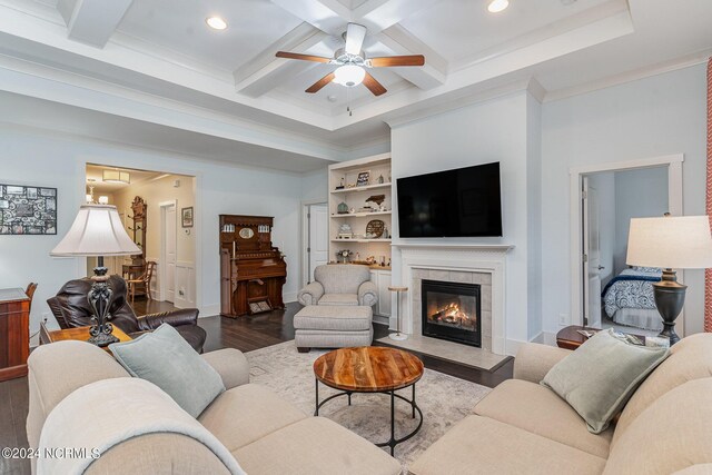 living room with coffered ceiling, a tiled fireplace, beam ceiling, ceiling fan, and hardwood / wood-style flooring