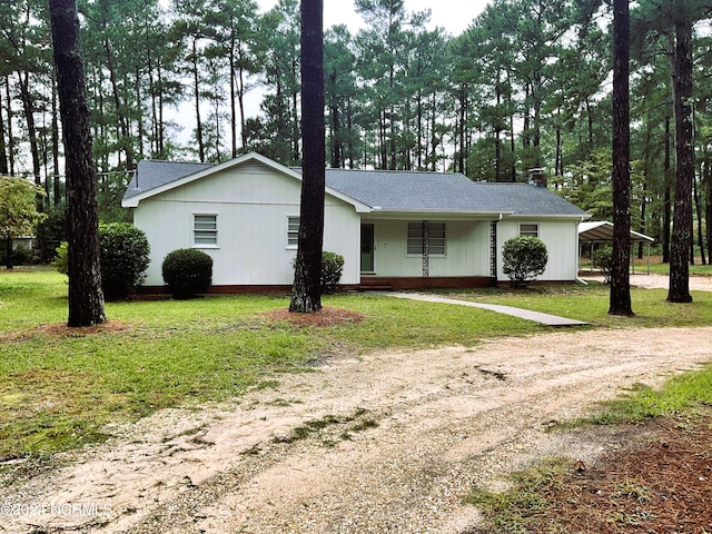 ranch-style home with a front yard