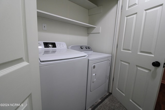 washroom with washer and dryer