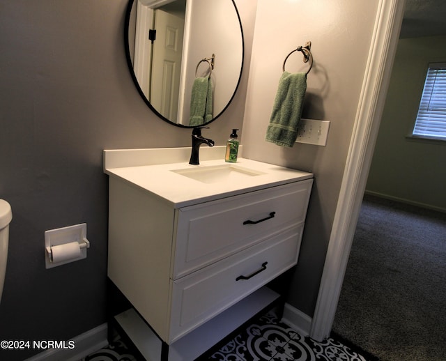 bathroom with vanity and toilet