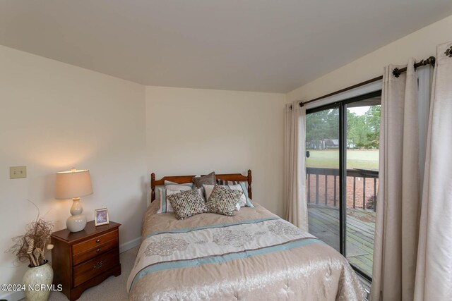 bedroom featuring carpet flooring and access to outside