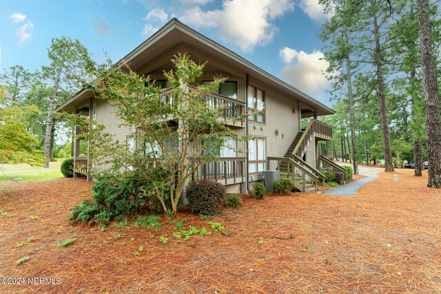 view of side of property featuring central AC unit