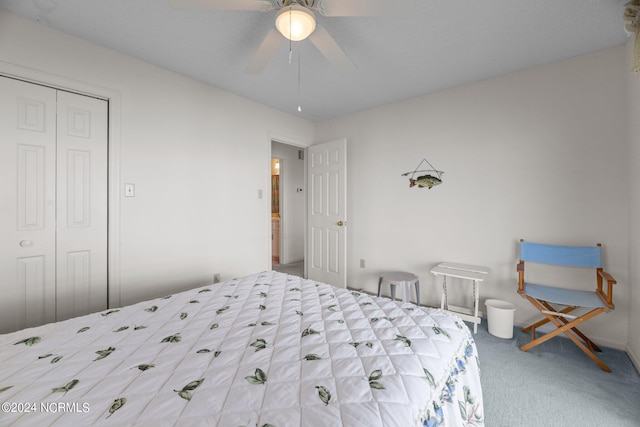 carpeted bedroom with ceiling fan and a closet