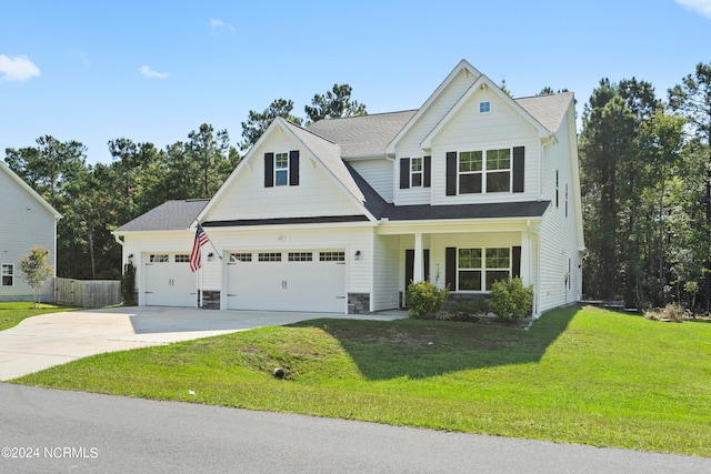 craftsman-style house featuring a front yard