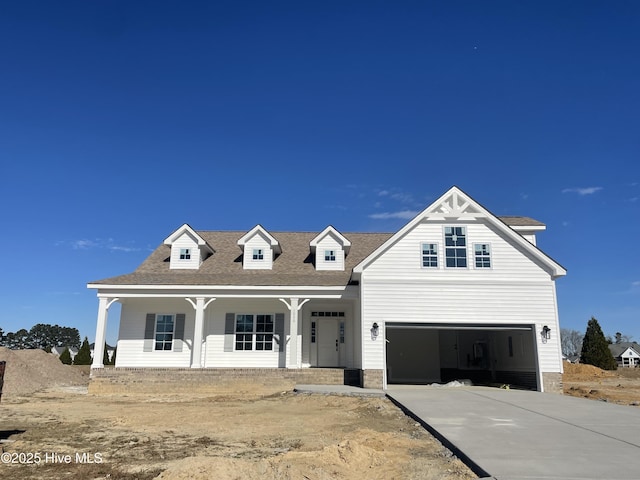 view of front facade with a porch and a garage