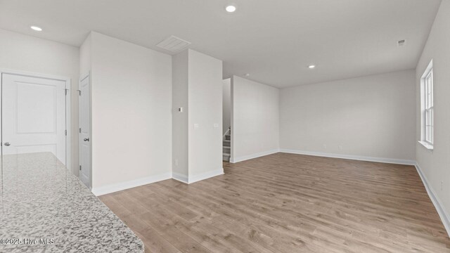 spare room with dark hardwood / wood-style flooring