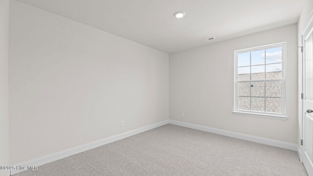 unfurnished room with ceiling fan and carpet floors