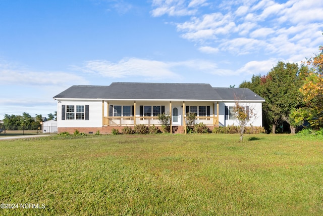 ranch-style house featuring a front yard and a porch