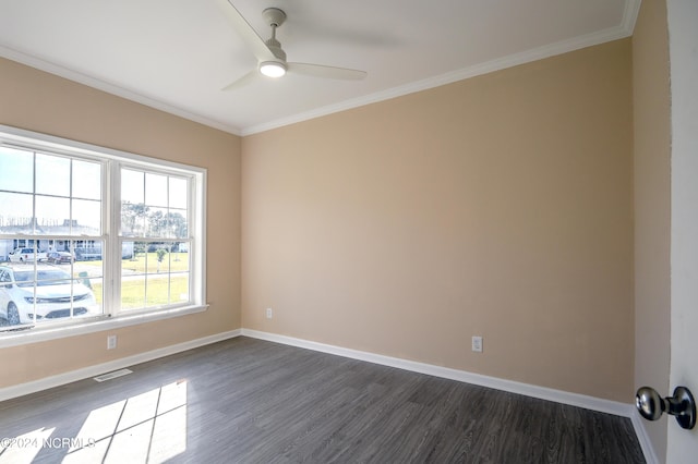 spare room with ornamental molding, ceiling fan, and dark wood-type flooring