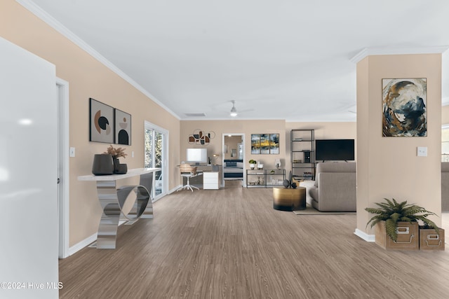 living room with ceiling fan, crown molding, and wood-type flooring