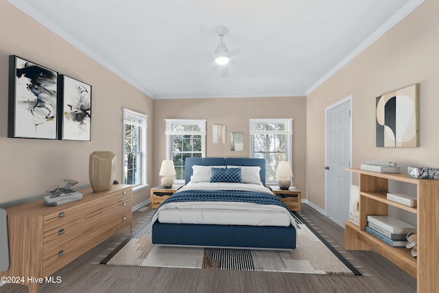 bedroom featuring crown molding and dark wood-type flooring