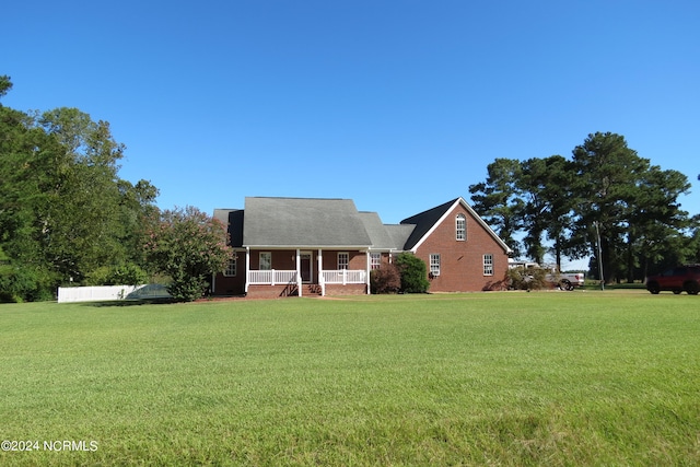 view of front of house with a front lawn and covered porch