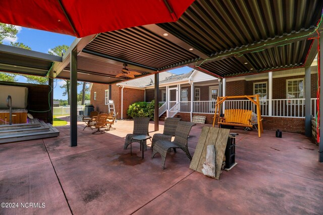 view of patio featuring ceiling fan