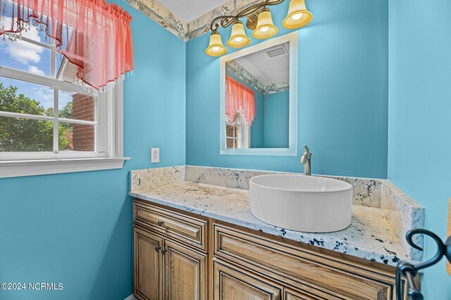 bathroom with vanity and a wealth of natural light